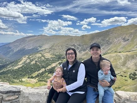 Adam and his family at a mountain overlook in Colorado