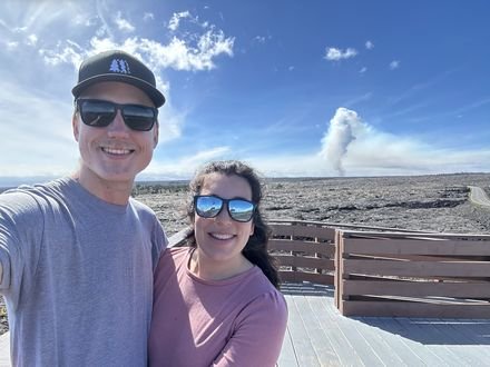 Adam and his wife at a volcano overlook in Hawaii